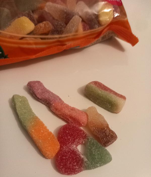 Individual types of gummy sweets including cola bottles, fizzy worms, and watermelons